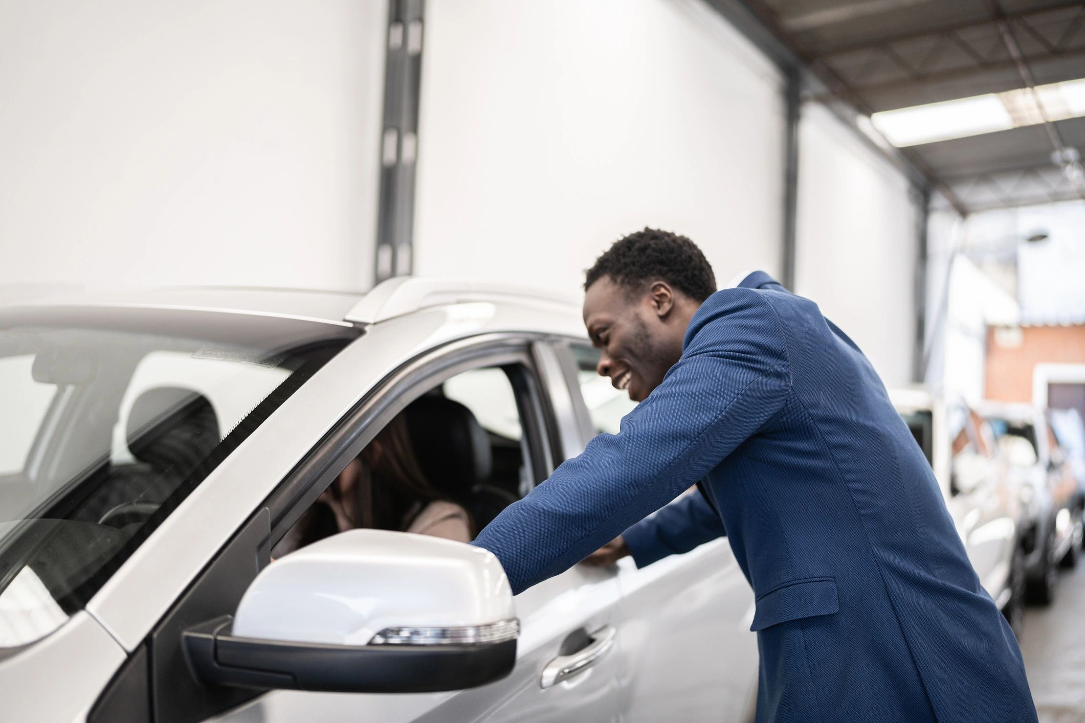 Customer receiving vehicle service at a shop