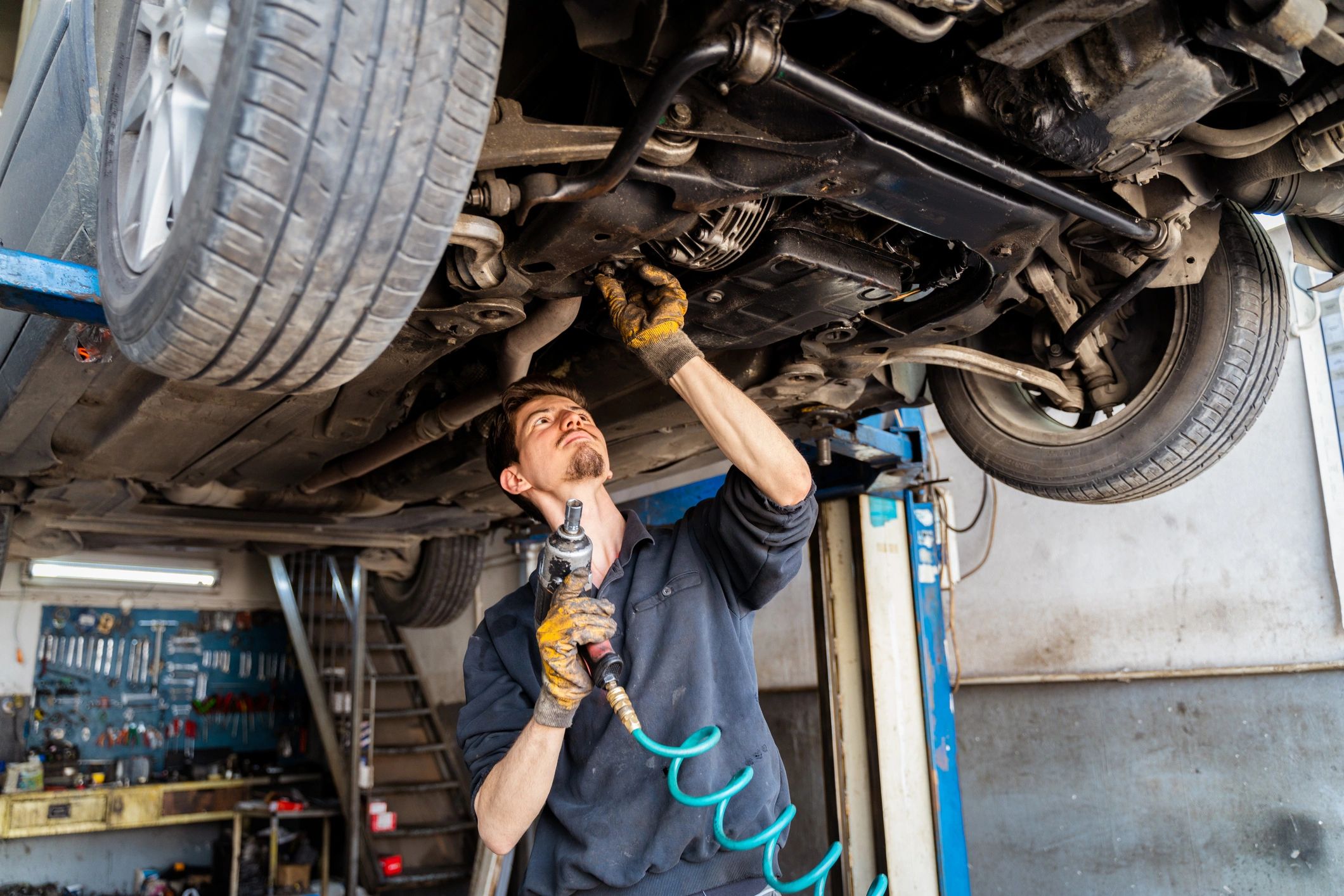 Car mechanic in an auto repair shop
