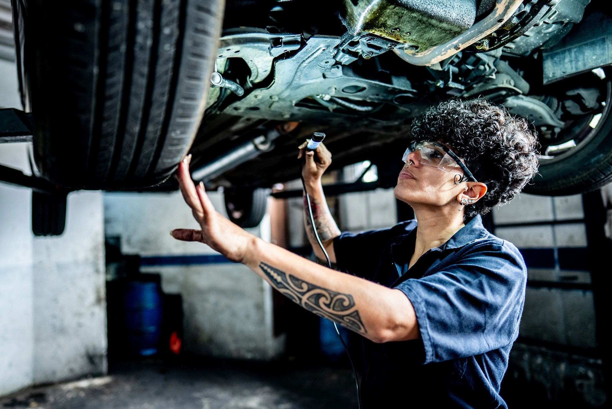 Mechanic inspecting a vehicle brake assembly