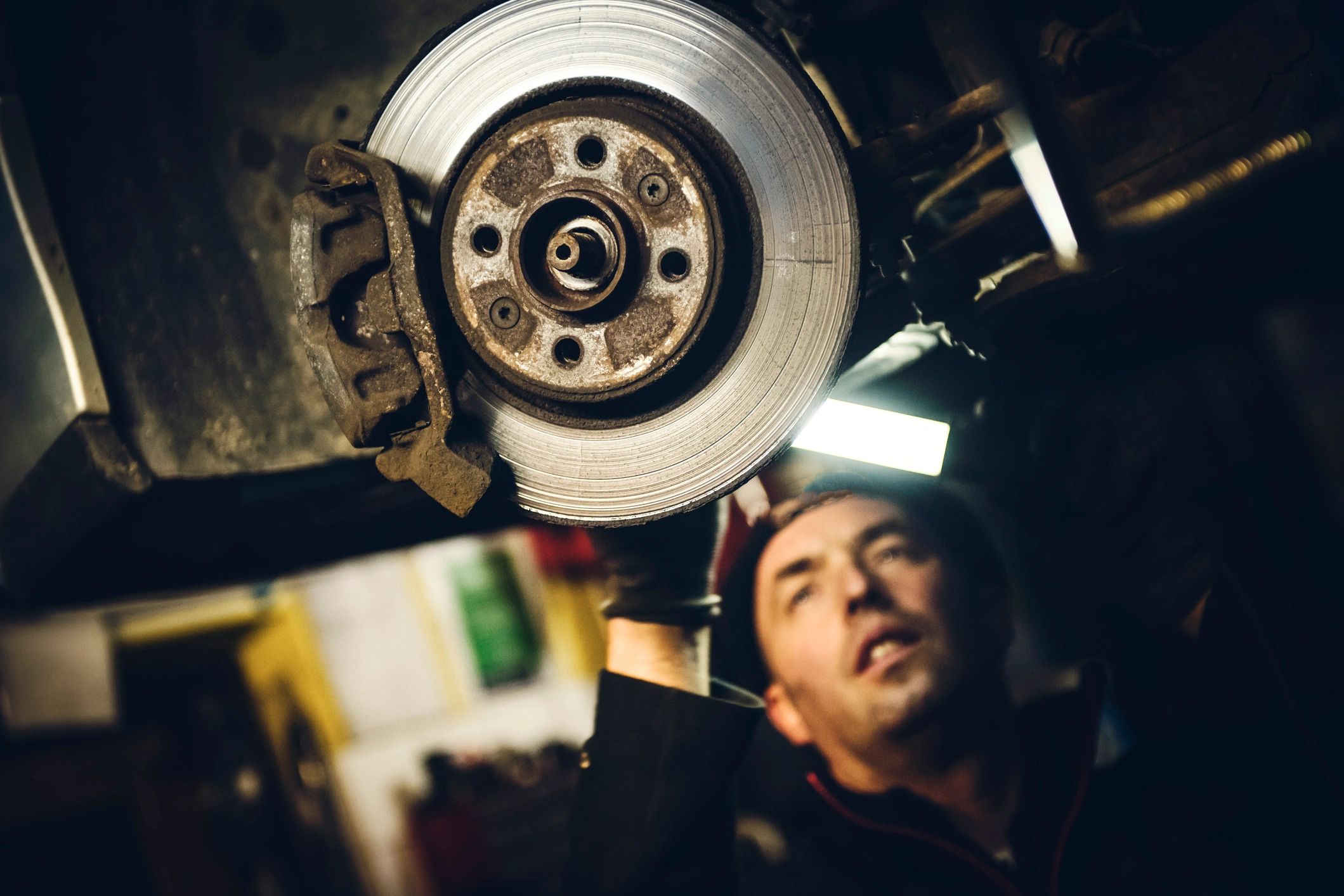 Auto mechanic in a service bay